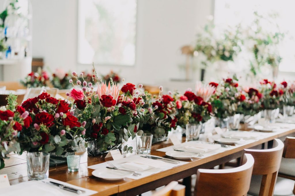 petite fleur table of roses at dinner setup