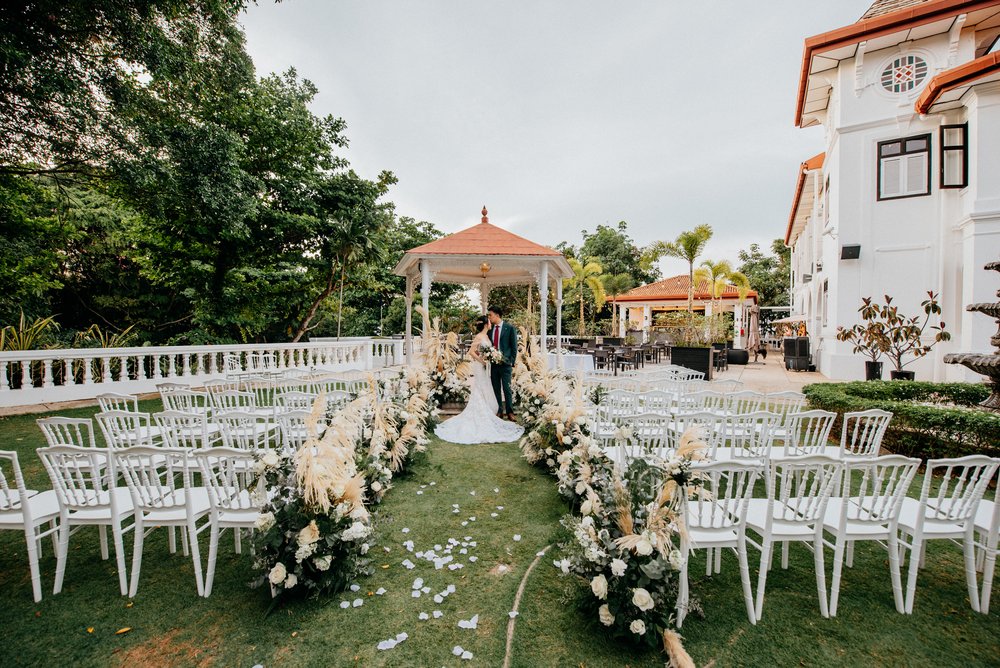 wedding decorated with flowers down the aisle