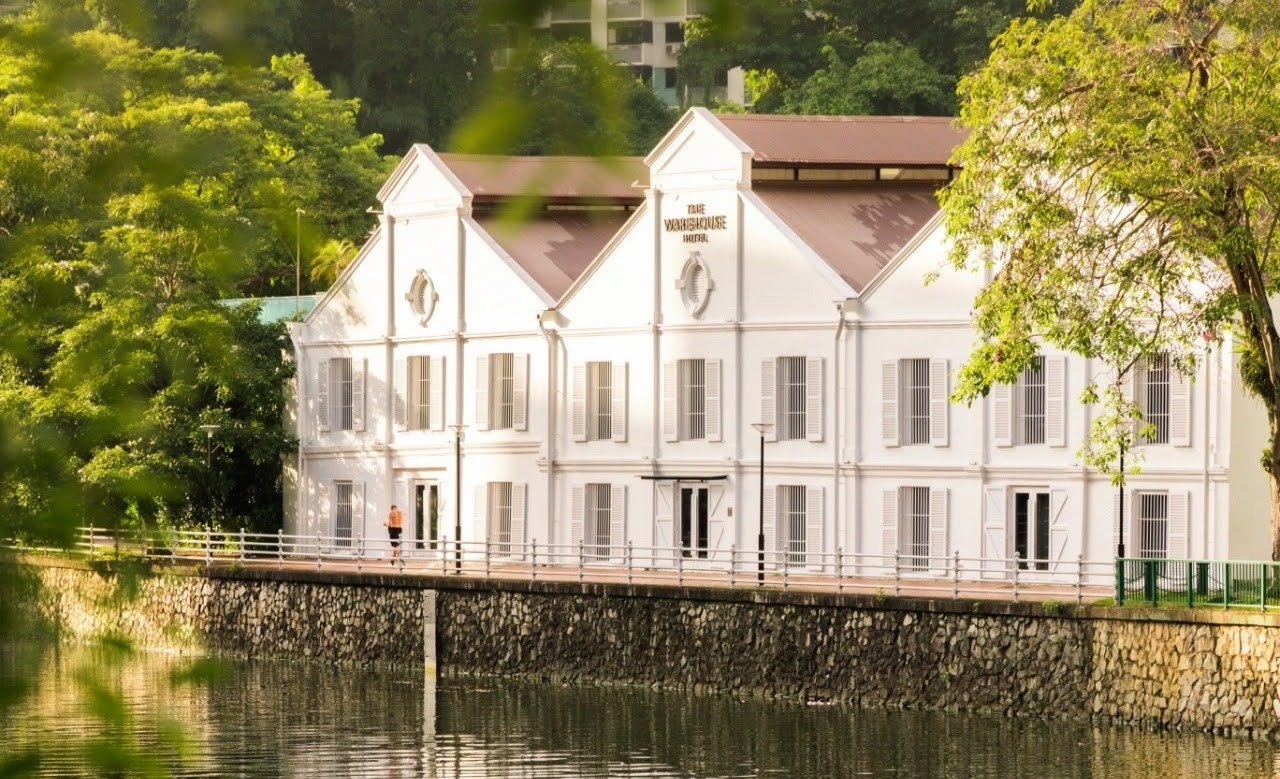 Riverfront exterior of The Warehouse Hotel in Singapore with heritage facade